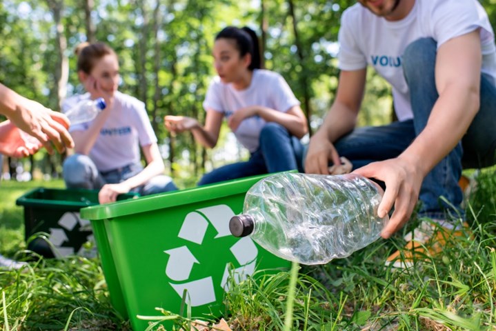 Group of people clean up garbage for recycling